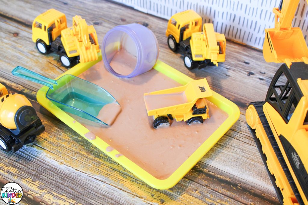 oobleck in tray with construction vehicles and scoop